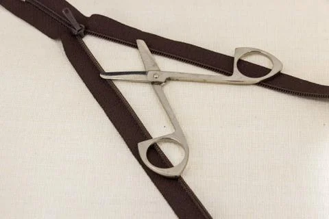 Composition shears cut the zipper Stock Photos
