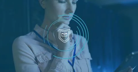 Composition of shield icon and data processing over caucasian female it 库存照片