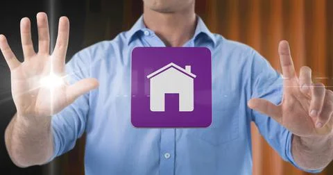 Composition of smiling businessman touching screen with digital home icon Stock Photos