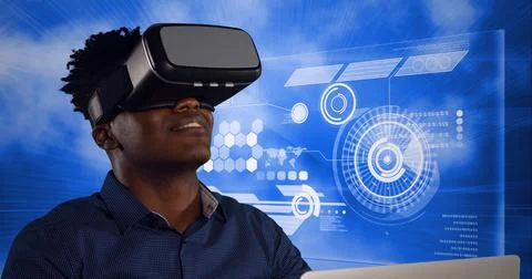 Composition of smiling man wearing vr headset over data processing and scopes 스톡 사진