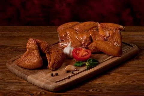 Composition with smoked chicken wings on the table. Stock Photos