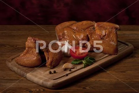Composition with smoked chicken wings on the table. Stock Photos
