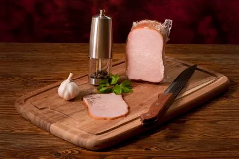 Composition with smoked vacuum packed ham on the table Stock Photos