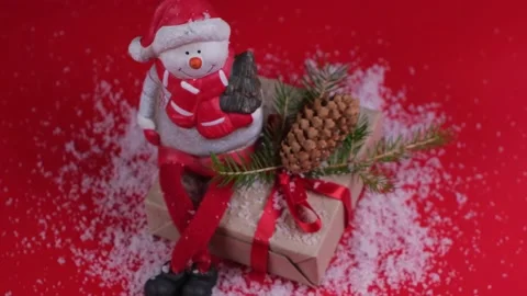 Composition with snowman sitting on a gift box. concept of New Years and Stock Footage 167522590