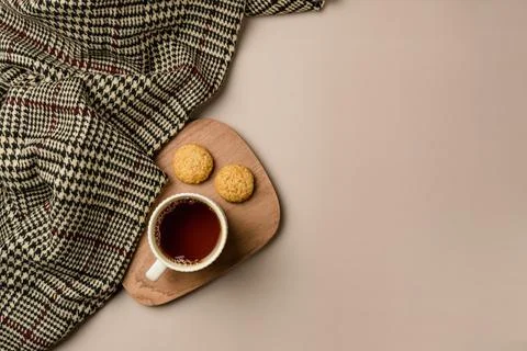 Composition with soft plaid and cup of tea. Copy space Stock Photos