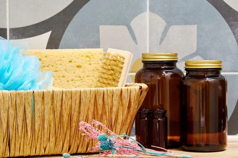 Composition with spa basket set and cosmetic bottles in the bathroom Stock Photos