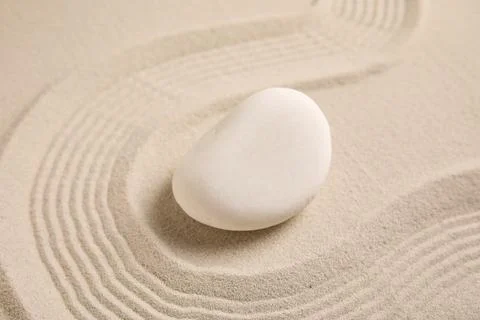 Composition with spa stone and lines on sand as background, closeup. Zen conc Stock Photos