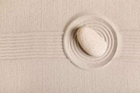 Composition with spa stone and lines on sand as background, closeup. Zen conc Stock Photos