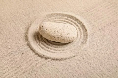Composition with spa stone and lines on sand as background, closeup. Zen conc Stock Photos