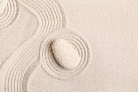 Composition with spa stone and lines on sand as background, closeup. Zen conc Stock Photos