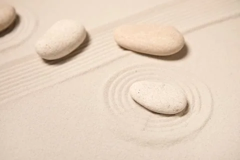 Composition with spa stones and lines on light sand as background, closeup. Z Stock Photos