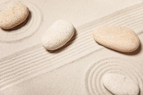 Composition with spa stones and lines on sand as background, closeup. Zen con Stock Photos