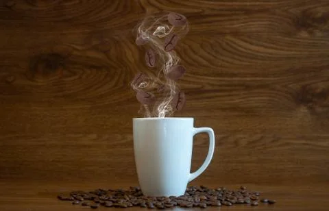 Composition with special effects of cup of hot coffee with coffee beans stray Foto stock