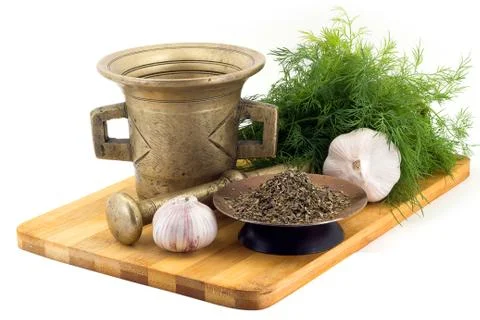 Composition of spices, Basil, dill, garlic, vintage spice grinder isolated .. Stock Photos