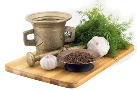 Composition of spices, Cumin, dill, garlic, vintage spice grinder isolated on Stock Photos