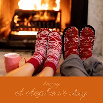 Composition of st stephen's day text over legs in christmas pattern socks by Stock Photos