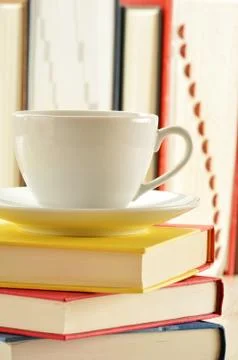 Composition with stack of books and cup of coffee Stock Photos