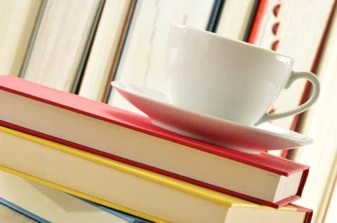 Composition with stack of books and cup of coffee Stock Photos