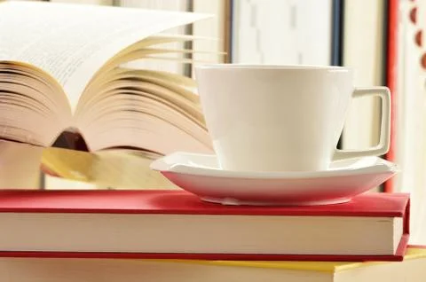 Composition with stack of books and cup of coffee 스톡 사진