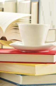 Composition with stack of books and cup of coffee Stock Photos