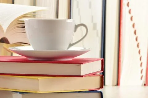 Composition with stack of books and cup of coffee Foto stock