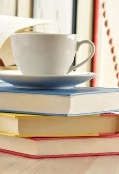 Composition with stack of books and cup of coffee Stock Photos