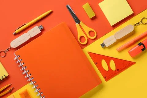 Composition with stationery and modern flash drive on color background Foto stock