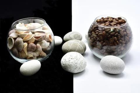 Composition, still life, glass with coffee grain, glass with shells, sea ston Stock Photos