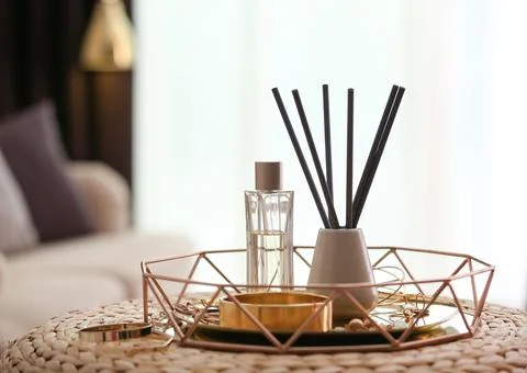 Composition with stylish accessories and interior elements on wicker pouf ind Foto stock