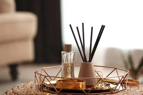 Composition with stylish accessories and interior elements on wicker pouf ind Foto stock