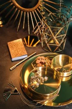 Composition with stylish accessories and interior elements on grey table Stock Photos