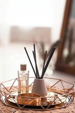 Composition with stylish accessories and interior elements on wicker pouf ind Foto stock