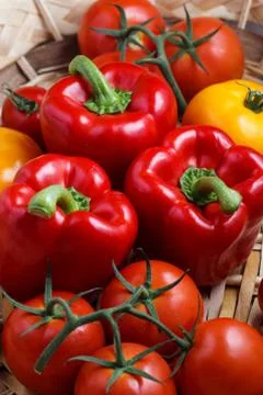 Composition of sweet red pepper and yellow tomatoes Stock Photos