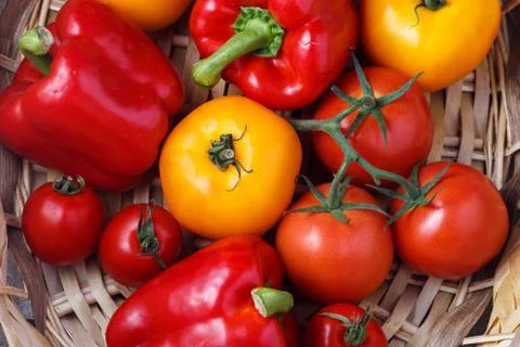 Composition of sweet red pepper and yellow tomatoes Stock Photos