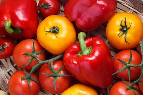 Composition of sweet red pepper and yellow tomatoes Stock Photos
