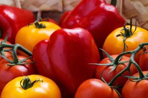 Composition of sweet red pepper and yellow tomatoes Stock Photos