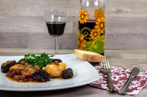 Composition at the table of a plate of sweet and sour cod Stock Photos
