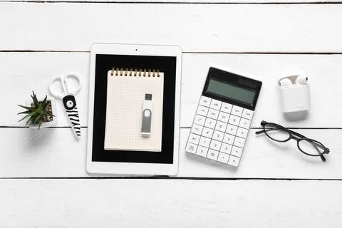 Composition with tablet computer, stationery and modern flash drive on white  Stock Photos