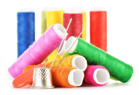 Composition with tailor needles and threads over white background Stock Photos