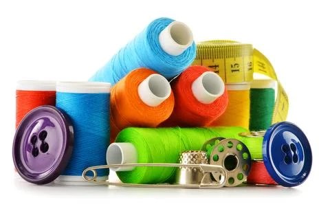 Composition with tailor threads over white background Stock Photos