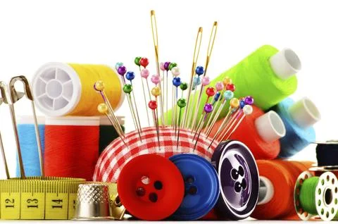Composition with tailor threads over white background Stock Photos