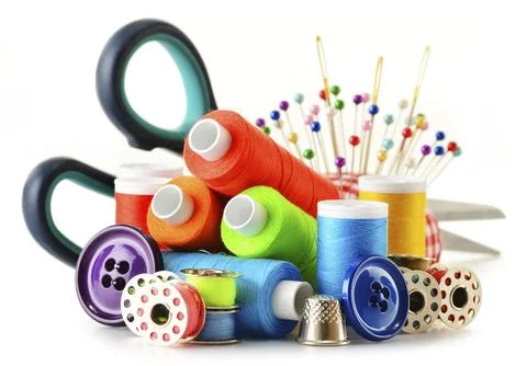 Composition with tailor threads over white background Stock Photos