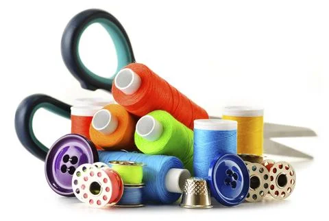 Composition with tailor threads over white background Stock Photos
