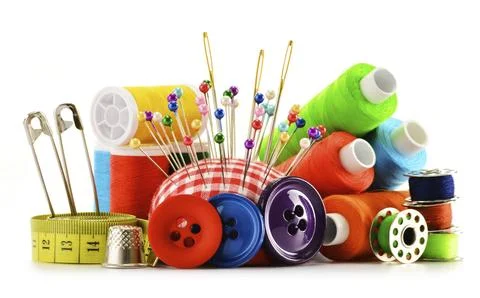 Composition with tailor threads over white background Stock Photos