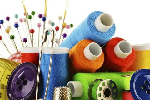 Composition with tailor threads over white background Stock Photos
