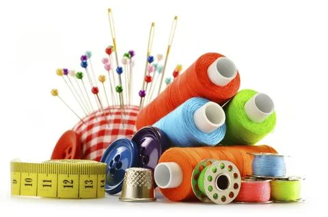 Composition with tailor threads over white background Stock Photos