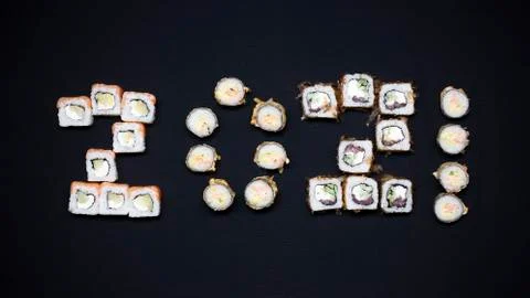 Composition with tasty sushi on dark background 2021 year Stock Photos