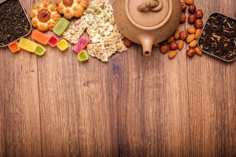 The composition of the tea on a wooden surface. brown teapot from clay with.. Stock-Fotos