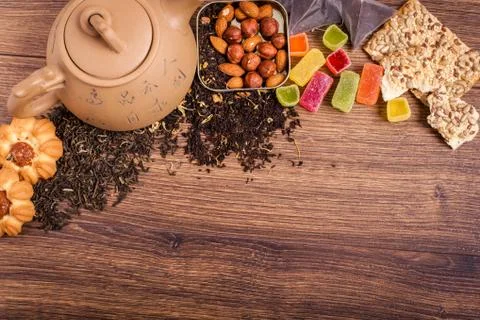 The composition of the tea on a wooden surface. brown teapot from clay with.. Stock-Fotos