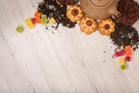 The composition of the tea on a wooden surface. brown teapot from clay with.. Stock Photos